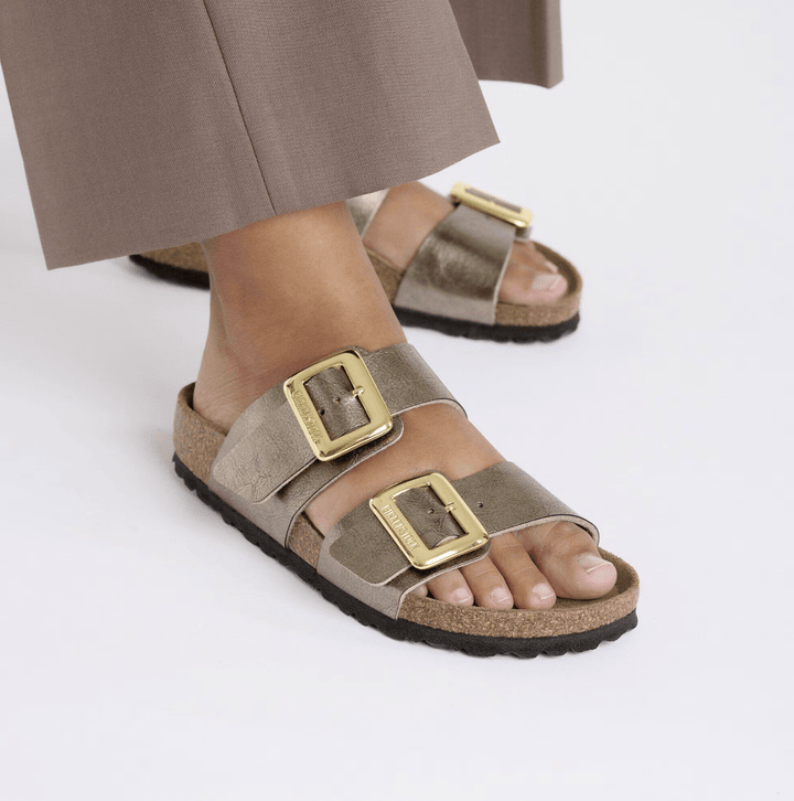 BIRKENSTOCK SYDNEY LUXE BUCKLE GRACEFUL TAUPE SANDAL SHOES | Shop now at Main &amp; Taylor Shoes!