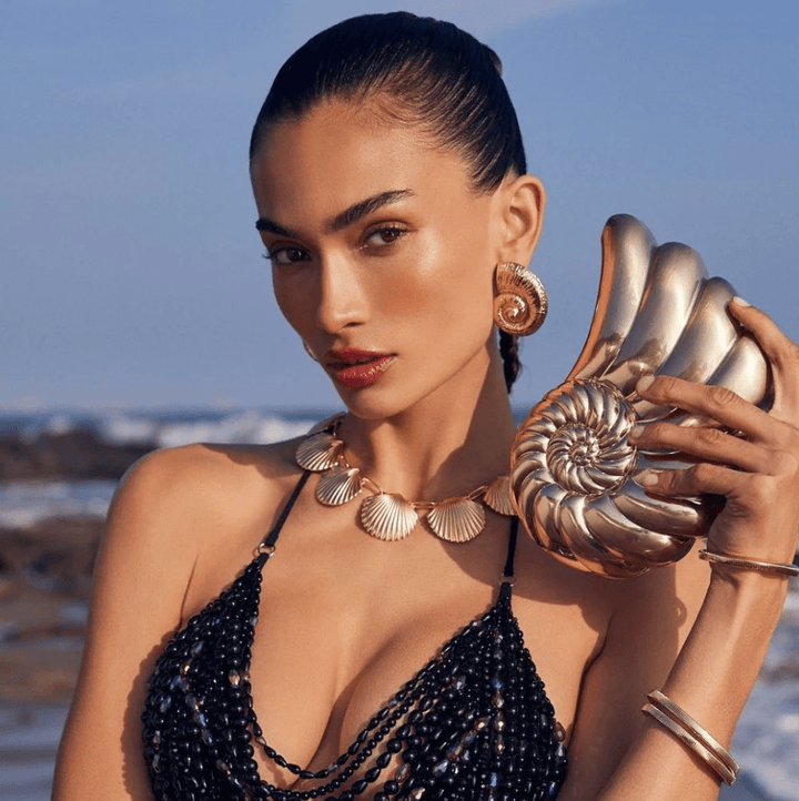 Olga Berg SHELLA HARD GOLD CLUTCH Handbags | Shop now at Main &amp; Taylor Shoes!