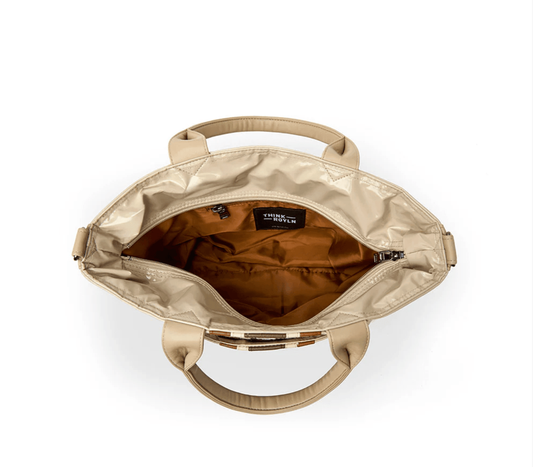 Think Roylin GETAWAY BLONDE PATENT TOTE Handbags | Shop now at Main &amp; Taylor Shoes!